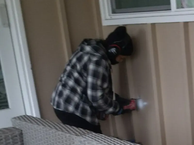 Professional electrician installing an exterior outlet in Lavon