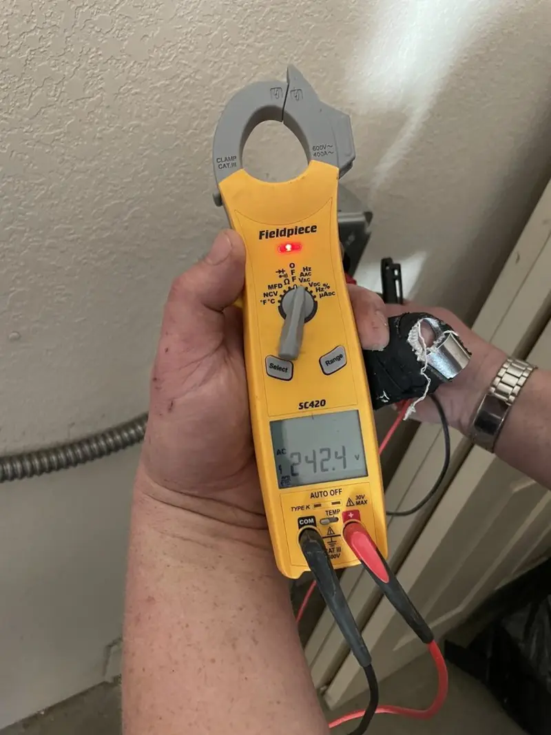 Voltage testing with clamp meter during Recessed Lighting Installation in Lavon